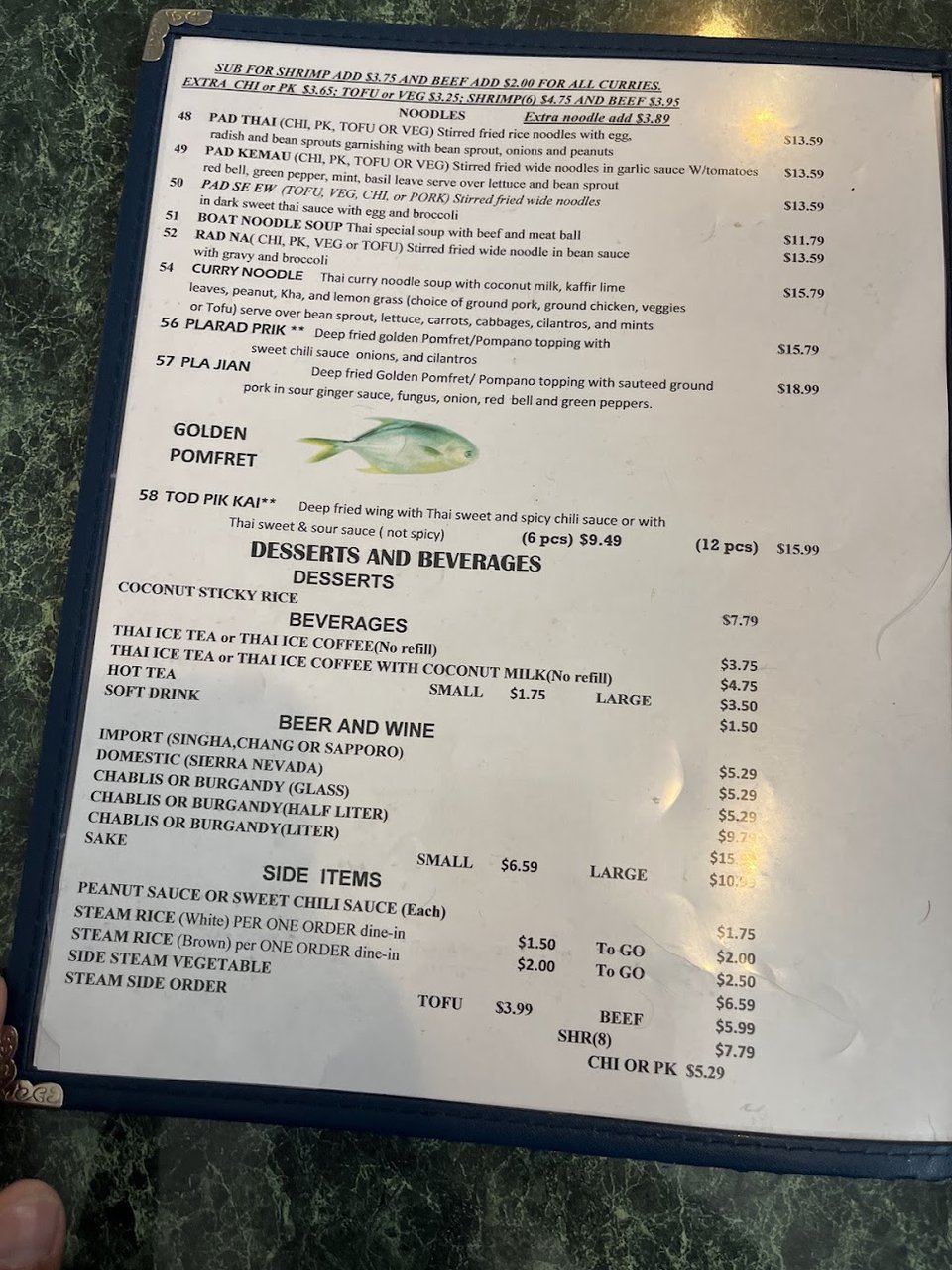 Curry and noodle dishes listed on a menu
